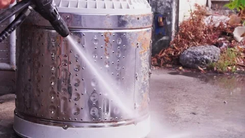 Clean the dirt adhering to the outer drum after prolonged use with high-pressure 스톡 동영상 169157724