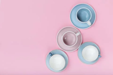 Clean dishes, coffee or tea set on pink background. top view and flat lay Stock Photos