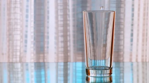 Clean drinking water being poured into a glass. Slow motion. Stock Footage 104818636