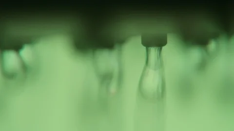 Clean drops of water falling from a metallic nozzle in a khaki bathroom Stock-Footage 88286161