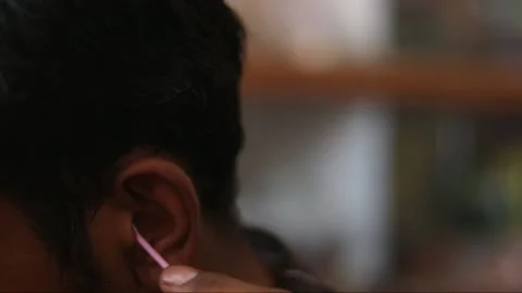 Clean the ears,close up shot man cleaning his ears, Stock Footage 133577382