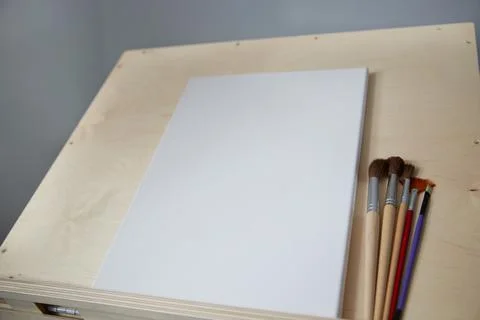 Clean easel with brushes. background with copy space. Stock Photos