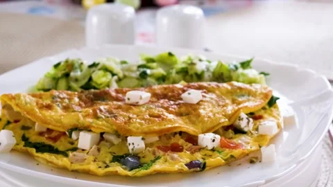 Clean Eating Breakfast with Egg Omelette and Green Salad Vídeos de archivo 332751154
