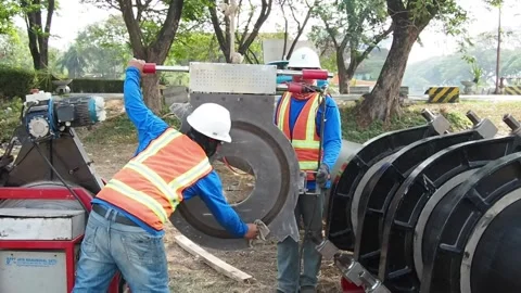 Clean an electric heat plate before using it to connect HDPE pipe. Stock Footage 159603568