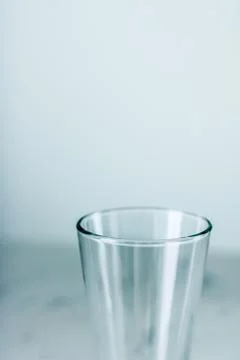 Clean empty glass on marble table Stock Photos