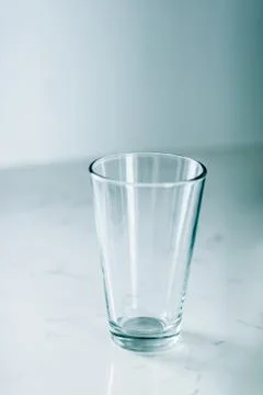 Clean empty glass on marble table Stock Photos