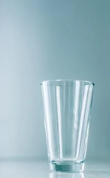 Clean empty glass on marble table Stock Photos