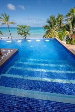 Clean empty pool on tropical beach Stock Photos