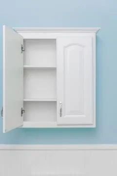 Clean empty white cabinet with one door open Foto stock