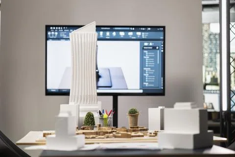 Clean empty workspace of real estate construction firm with planning documents Stock Photos
