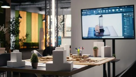 Clean empty workspace of a real estate architecture firm with planning documents Stock Photos