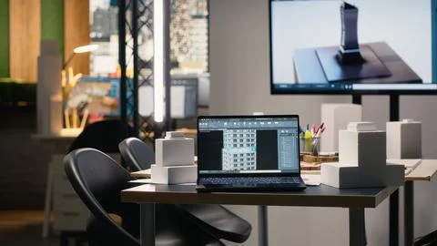 Clean empty workspace of a real estate architecture firm with planning documents Stock Photos