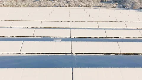 Clean Energy Rows Covered in Deep Snow Blanket, aerial view Stock Footage 336032473