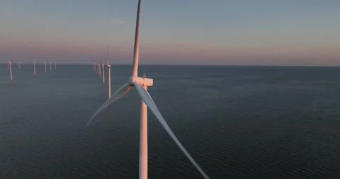 Clean energy, wind energy, wind farm, green energy, wind turbines at sunset Video stock 310659364
