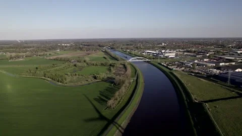Clean energy wind turbine casting moving shadows on countryside field Video stock 276170643