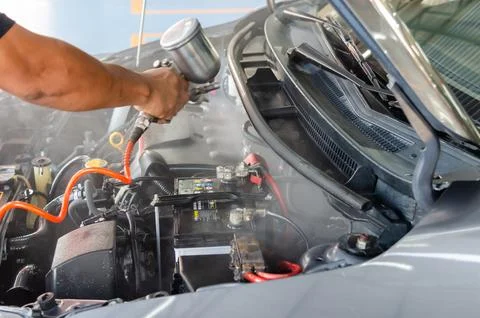 Clean the engine after washing the engine. Spraying the engine room varnish Fotos Stock