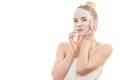 The clean face mask on the young woman on the white background Photo