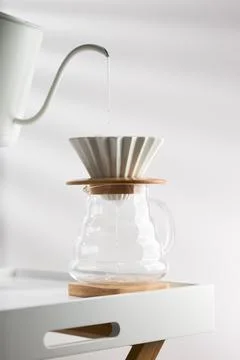 Clean the filter paper before drip coffee Stock Photos