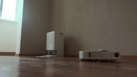 Clean floors without hassle robot vacuum simplifies daily life by keeping your Stock Footage 314641369