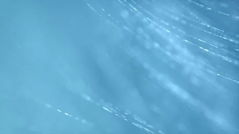 Clean Flowing Dotted Lines on a Light Blue Background 库存影片 338435899
