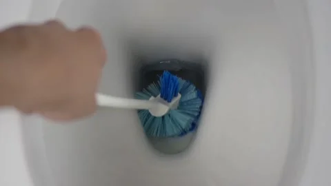 Clean flush toilet using brush Stock Footage 102903771