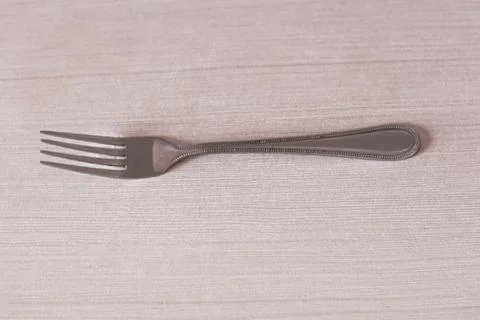 Clean fork on the table in the room 写真素材