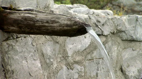 Clean, fresh, natural spring of drinking water with wooden channel Stock Footage