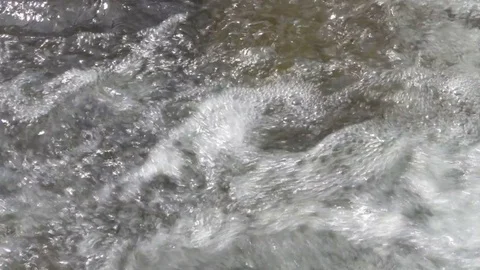 Clean fresh water stream running across stones Stock Footage 78733368