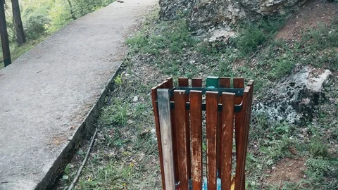 A Clean garbage can of wood Next to the pedestrian walkway in the mountain Stock Footage 108034784