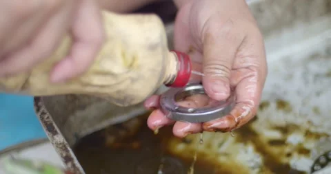 Clean grease from car parts.Clean car parts before assembly. Stock Footage 277414802