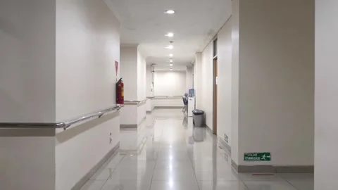 Clean hallway with polished tile and recessed lighting Stock Footage 345457912