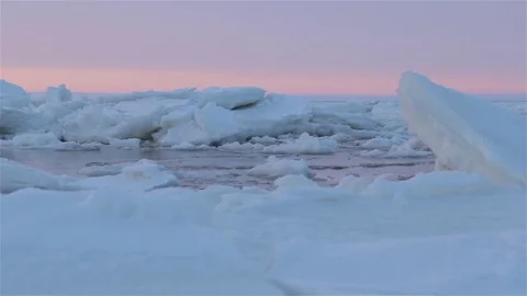 Clean ice surface in the middle of floes. Tracking shot of frozen sea Video stock 74991721