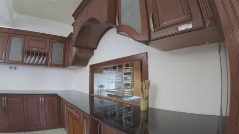 A clean kitchen cabinet a mirror in the middle pan display Video stock 97207457