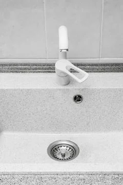 Clean kitchen sink. Bright kitchen with free dishwasher. Stock Photos