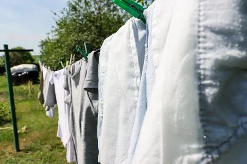 Clean laundry is drying outdoors on a warm, sunny day. Foto stock