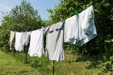Clean laundry is drying outdoors on a warm, sunny day. Foto stock
