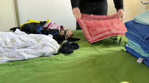 Clean laundry folded by a man Stock-Footage 151289773