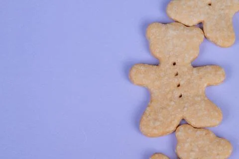 Clean layout showcasing bear cookies on vibrant purple background. Minimalist pr Stock Photos