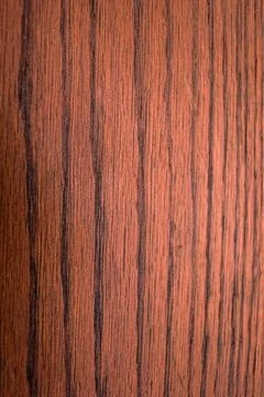 Clean, linear texture of reddish-brown wood laminate with horizontal grain lines Stock Photos