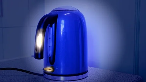 Clean looking kettle under blacklight reveals invisible germs Stock Footage 128206240