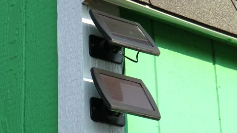 Clean Mini Solar Panels on the Side of Backyard Shed Stock Footage 160447617