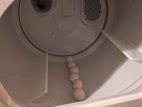 A clean, minimalist view inside a clean home laundry machine drum Stock Photos