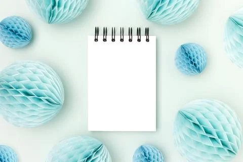 Clean notepad mockup and tissue paper balls on a blue background. Stock Photos