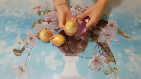 Clean onion with a knife Stock Footage 137194444