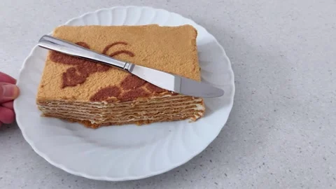 Clean Overhead of Layered Cake Slice with Stainless Knife Vídeo Stock 320284898