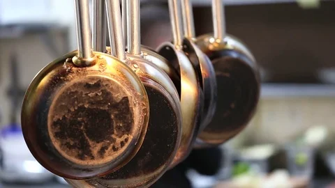 Clean pans hanging in the kitchen Stock Footage 72871555