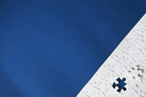 Clean puzzle elements on the background. Empty puzzle piece on the table. T.. Stock Photos