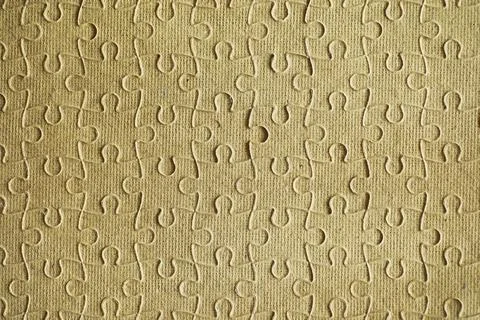 Clean puzzle elements on the background. Empty puzzle piece on the table. T.. Stock Photos