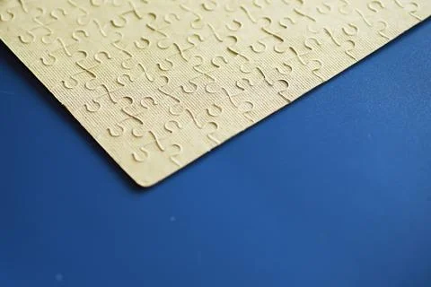Clean puzzle elements on the background. Empty puzzle piece on the table. T.. Stock Photos