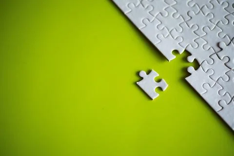 Clean puzzle elements on the background. Empty puzzle piece on the table. T.. 스톡 사진
